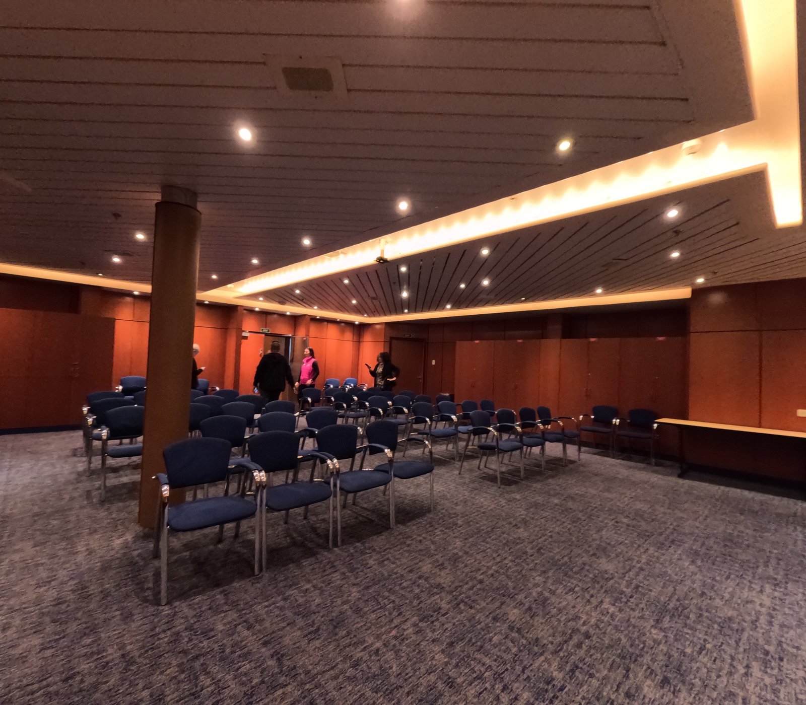 A conference room set up for a group meeting aboard ship